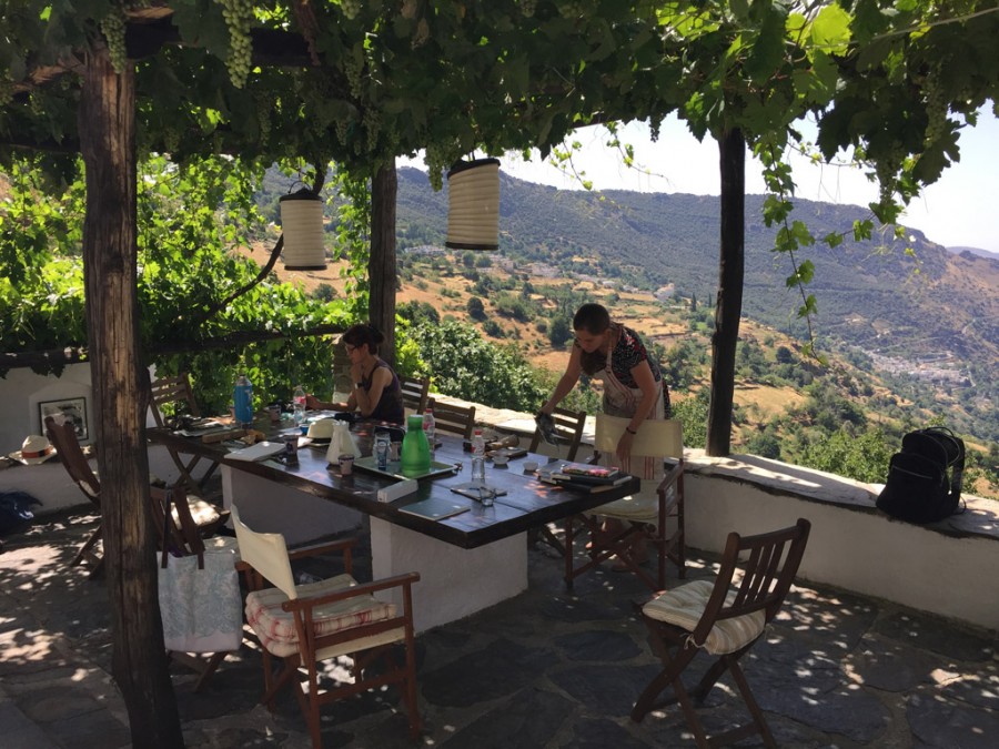 Did I mention the view? From the terrace with the old work table we can see the two villages in the valley below Capileira. Gabriela and Eugenia at the table.